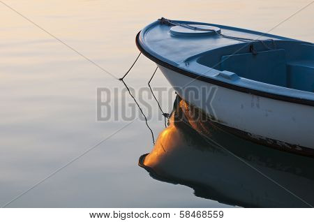 Small boat in sunrise light
