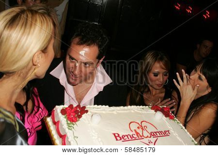 HOLLYWOOD - AUGUST 28: Tabitha Taylor with Brian Wallos and Jennifer Cantrell at the Benchwarmer Trading Cards' Summer Birthday Celebration August 28, 2006 in Les Deux, Hollywood, CA.