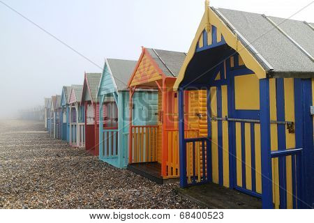 Beach huts in fog
