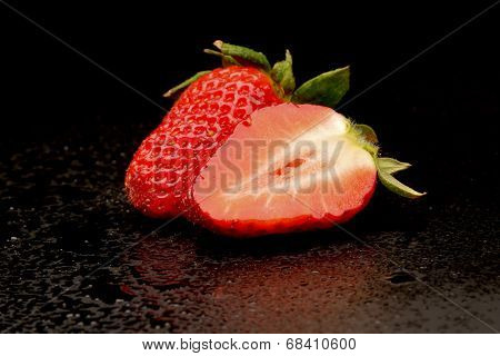 Frech Strawberries With Leaves On Black Background