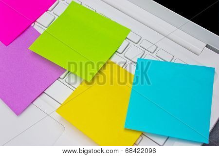 Colorful Sticky Notes Post On White  Laptop's Keyboard