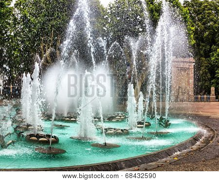 Illuminated water features in front of Palais des Congress in Perpignan, France