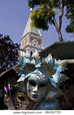 Venetian Carnival Masks And San Marco Bell Tower In Venice