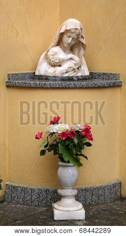 PORTOFERRAIO, ELBA, ITALY - MAY 03, 2014: The statue of Madonna with the Child in front of the Church of the Holy Sacrament in Portoferraio, Island of Elba, Tuscany, Italy on May 03, 2014 