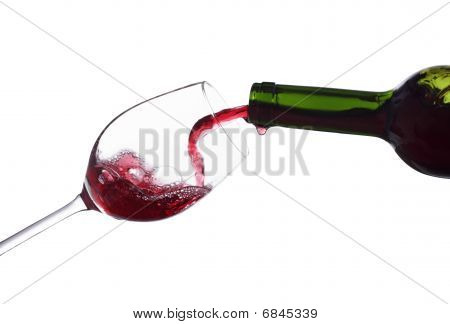 wine being poured into a glass isolated on white