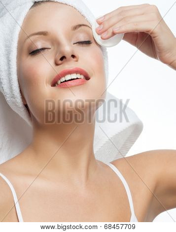 closeup portrait of attractive  caucasian smiling woman blond isolated on white studio shot lips toothy smile face hair head and shoulders towel mirrow cleaning cotton disc