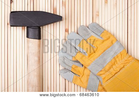 Hammer and protective gloves.