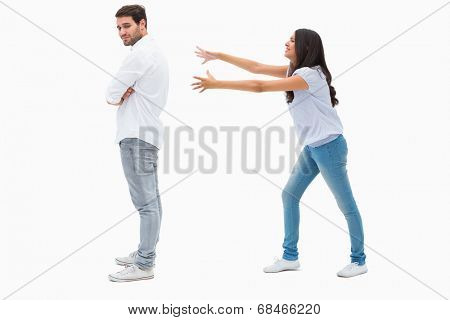 Brunette reaching desperately for man on white background
