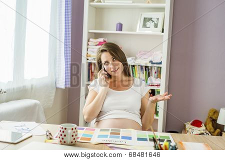 Pregnant woman working from home