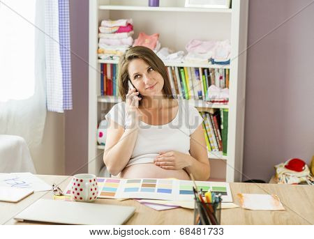 Pregnant woman working from home