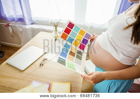 Pregnant woman working from home