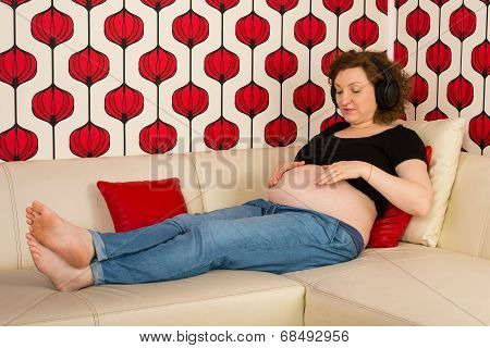 Pregnant Listen Music And Touching Belly
