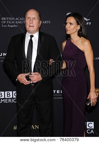 LOS ANGELES - OCT 30:  Robert Duvall & Luciana Pedraza arrives to the BAFTA Jaguar Brittannia Awards 2014 on October 30, 2014 in Beverly Hills, CA                