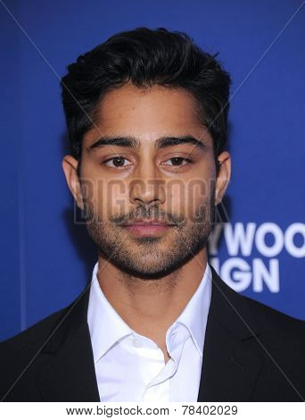 LOS ANGELES - AUG 14:  Manish Dayal arrives to the HFPA Annual Installation Dinner 2014 on August 14, 2014 in Beverly Hills, CA                