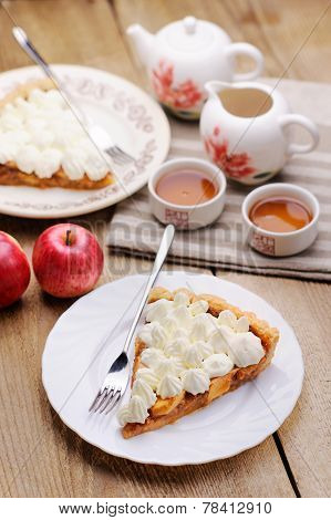 Piece Of Cake Decorated With Whipped Cream With Teaware And Apples T