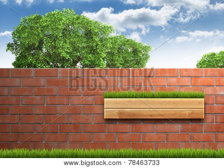 Grown tree with brick wall on green fresh grass.
