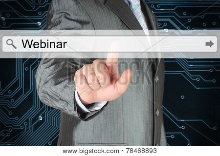 Businessman pushing virtual search bar with webinar word