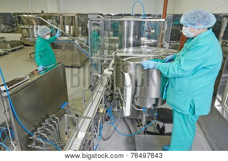 pharmaceutical factory woman worker operating production line at pharmacy industry manufacture factory