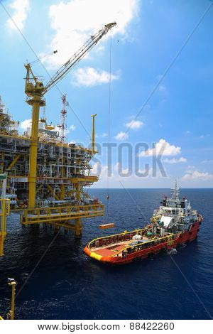 Crane operation on offshore construction platform.Cargo being loaded from a offshore platform