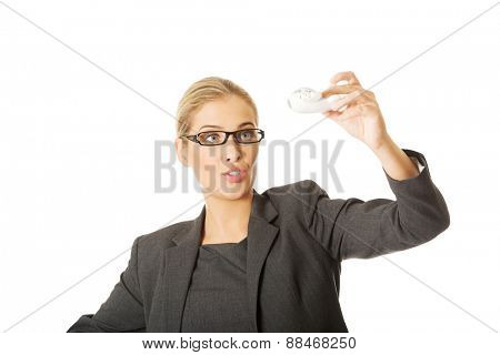 Beautiful businesswoman with plane toy in hand