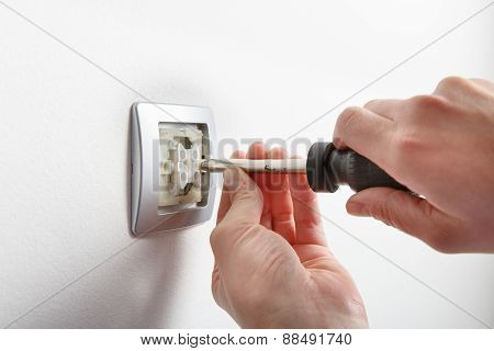 Electrician Installing A Light Switch