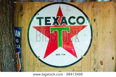 Old Texaco Sign On Wood Wall