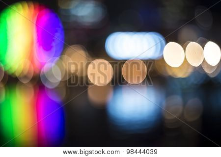 Blurred Bokeh Night Habor Lights Background With Rainbow Ferris Wheel