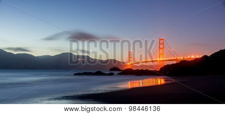 Golden Gate Bridge and Marin Hills Panorama at Dusk. Baker Beach, San Francisco, California, USA.