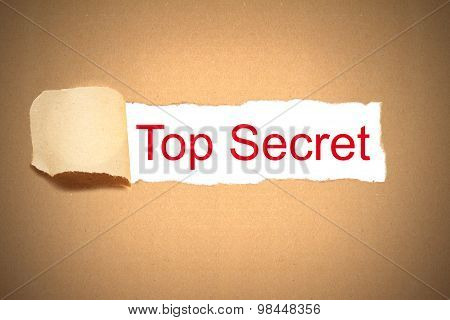 Brown Paper Torn To Reveal Top Secret