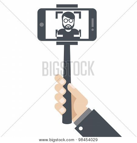 Hand with smartphone on selfie stick