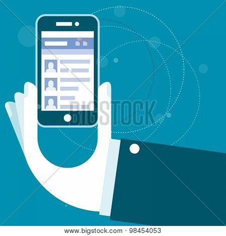 Hand with smartphone and open social network website