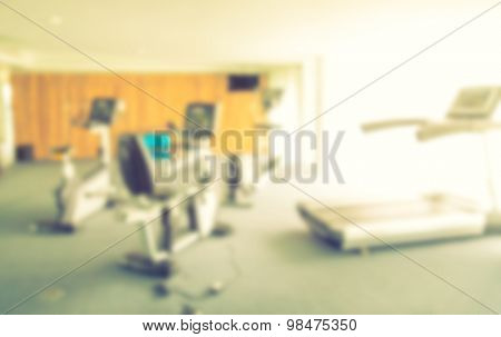 Abstract blur Fitness center with traineger equipments  ( Filtered image processed vintage effect. )