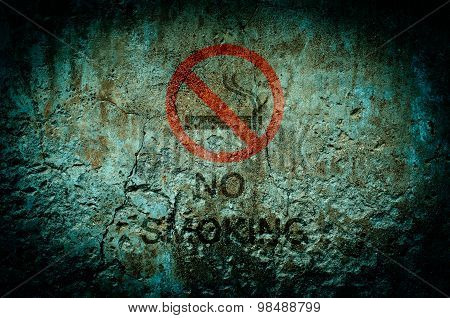 No Smoking Warning Sign On Dirty Wall Background With Grunge And Vignette Tone