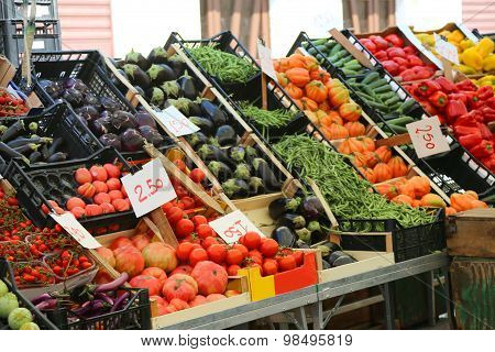 Fruit And Vegetable Stand With Basket Full Of Seasonal Fruits In The Local Market Of The City