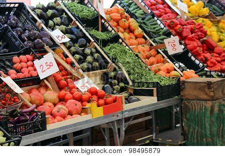 Fruit And Vegetable Stand With Basket Full Of Seasonal Fruits In The Local Market