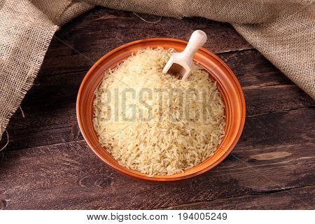 Rice, Indian Basmati, Pakistani Basmati Uncooked On Brown Background