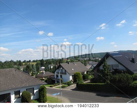 Nature houses sky  village summer street trees