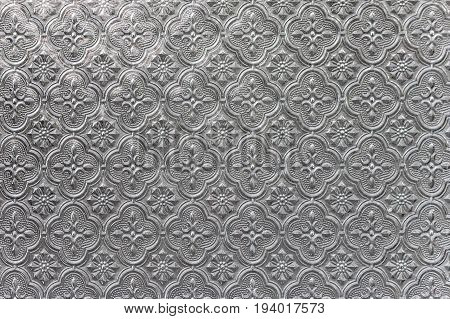 Vintage pattern on glass texture background close-up view