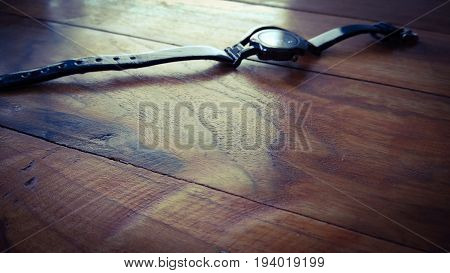 stylish lades hand watch in box on dark shed wood background