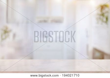 Products Display Concept. Empty pink marble top table for product display with blurred bathroom interior Bckground.