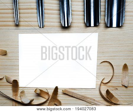 Blank Business Card On Wooden Table For Carpenter Tools With Sawdust Top View.
