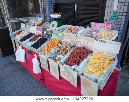 OSAKA CASTLE: OSAKA, JAPAN - APRIL 3, 2017: Dried sweet fruits for sale at street market in Osaka, Japan