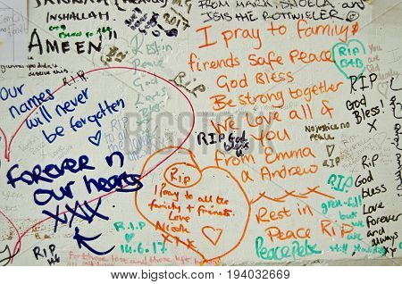 LONDON UK - JULY 6 2017: Memorial messages written on a wall close too the Grenfell Tower block of council flats in which at least 80 people are feared to have died in a fire in Kensington West London.