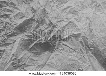 Rough white paper texture. Crumpled paper texture and background. Close up view of wrinkled white texture made with paper. Abstract texture and background for designers.