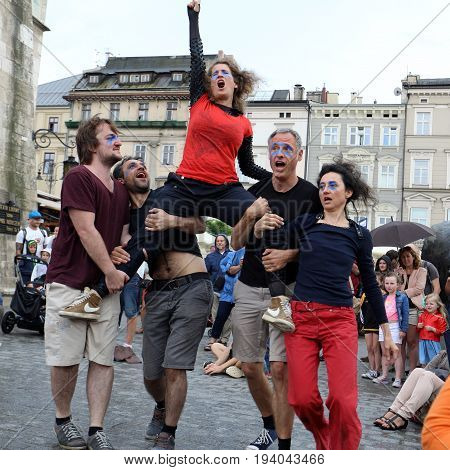 CRACOW POLAND - JULY 5 2017: 30th Street - International Festival of Street Theaters in Cracow Poland. An Odyssey Towards New Shores - a street parade