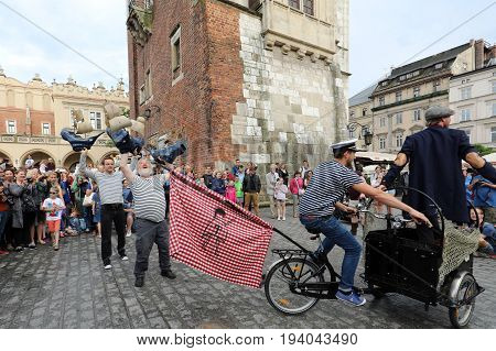 CRACOW POLAND - JULY 5 2017: 30th Street - International Festival of Street Theaters in Cracow Poland. An Odyssey Towards New Shores - a street parade