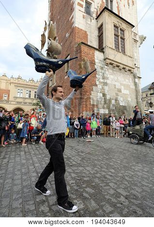 CRACOW POLAND - JULY 5 2017: 30th Street - International Festival of Street Theaters in Cracow Poland. An Odyssey Towards New Shores - a street parade