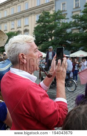 CRACOW POLAND - JULY 5 2017: 30th Street - International Festival of Street Theaters in Cracow Poland. An Odyssey Towards New Shores - a street parade