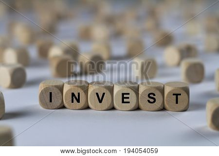 Invest - Cube With Letters, Sign With Wooden Cubes