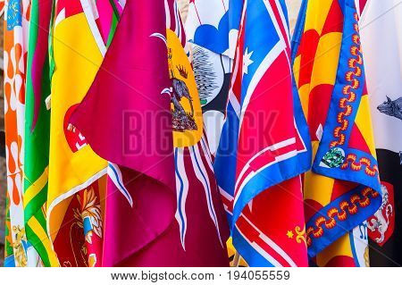 Siena, Italy - November 16, 2014: Banners flags of the Contrade in Siena, Tuscany